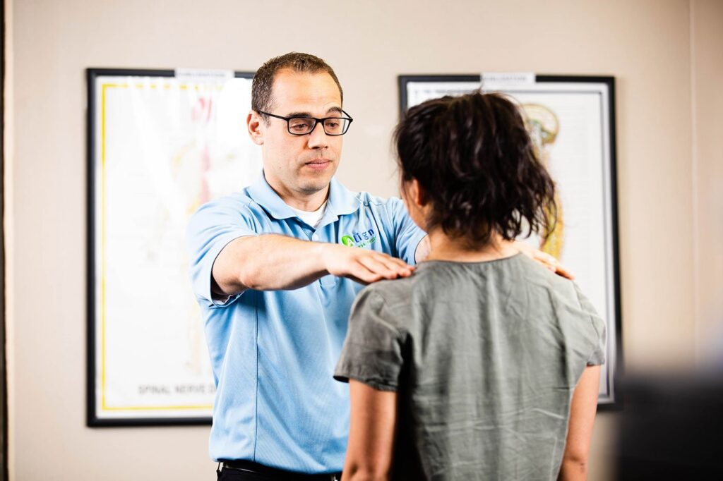 Chiropractor checking posture